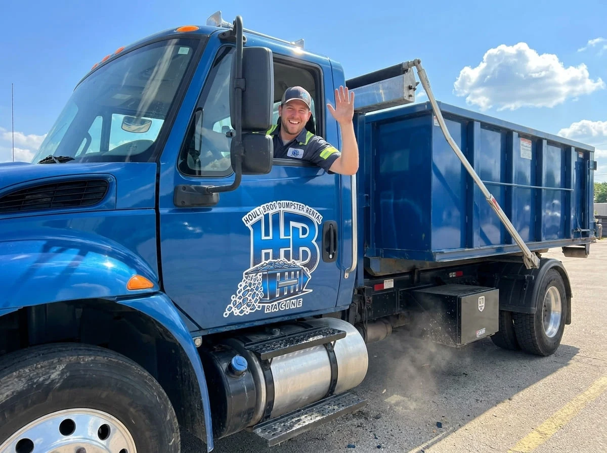 A Hoult Bros Dumpster Rental Racine driver ready for delivery in Racine, WI
